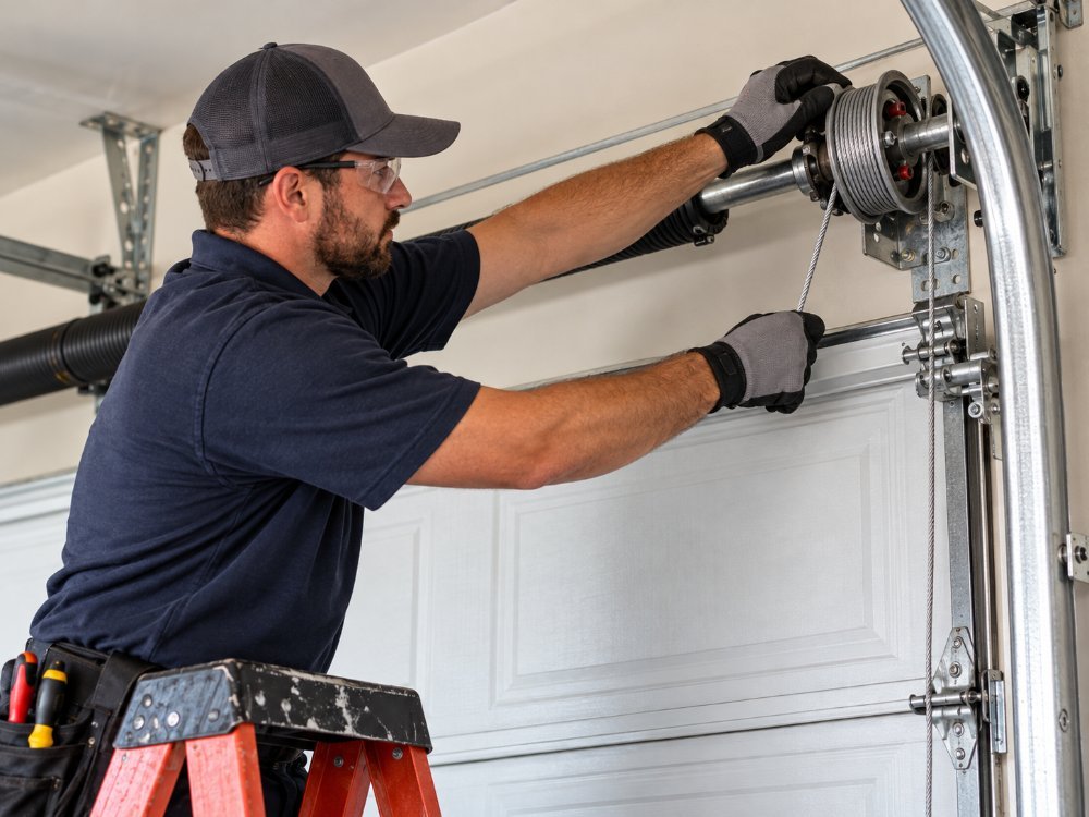family-owned garage door company technician working in Houston